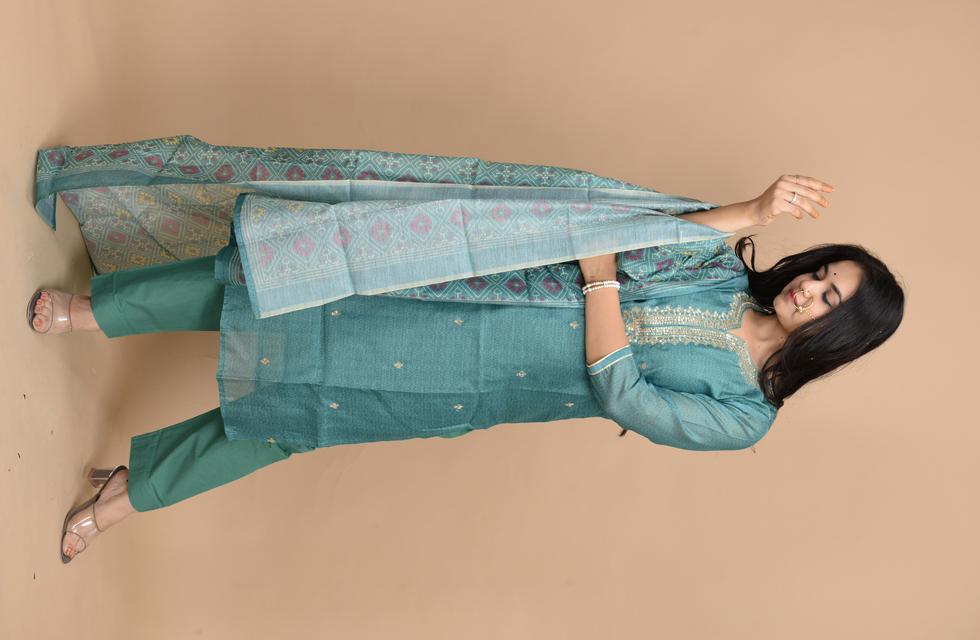 Gorgeous Pure Chanderi Suit Set With Aari Tari Work In Bottle Green Color